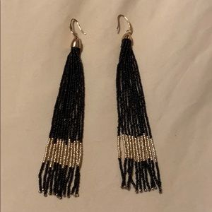 Black beaded shoulder duster earring.